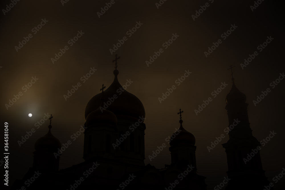 Foggy church at night