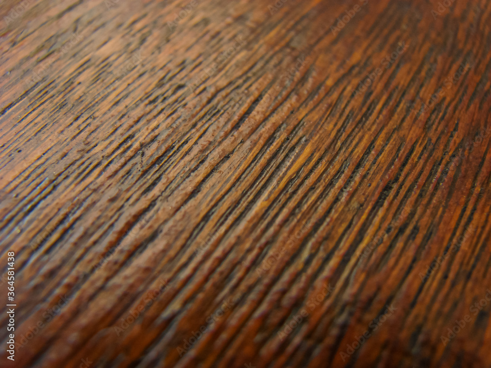 Fototapeta premium Wooden table close up - warm brown colors - texture