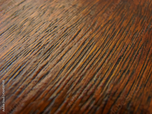 Wooden table close up - warm brown colors - texture