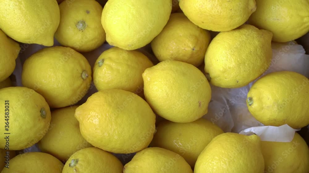 Fresh lemons in a market. Texture yellow citrus fruit lemon Fresh lemons in a market. Texture yellow citrus fruit lemon