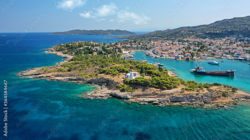 Aerial drone bird's eye view photo of picturesque neoclassic houses in historic and traditional island of Spetses with emerald clear waters, Saronic Gulf, Greece