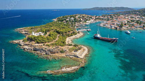 Aerial drone bird's eye view photo of picturesque neoclassic houses in historic and traditional island of Spetses with emerald clear waters, Saronic Gulf, Greece © aerial-drone