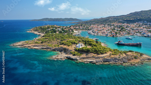 Fototapeta Naklejka Na Ścianę i Meble -  Aerial drone bird's eye view photo of picturesque neoclassic houses in historic and traditional island of Spetses with emerald clear waters, Saronic Gulf, Greece