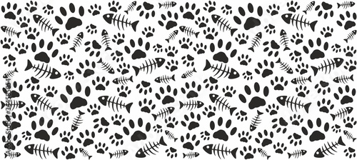 Fingerprints and skeletons of fish. Black on a white background. Endless seamless vector pattern of cat tracks. Pads and fish bones