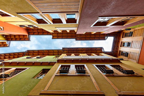 Looking up the colorful houses in the old town Gjakova, Kosovo photo