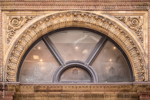 Fotografie Arch Shaped Window of a Commericial Building