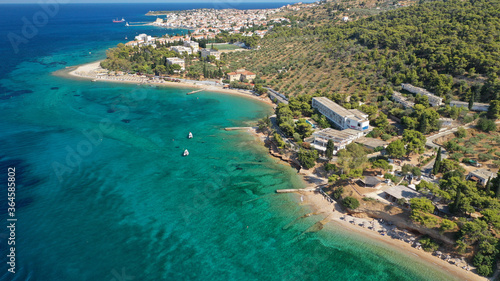 Aerial drone photo of Hinitsa bay a popular anchorage crystal clear turquoise sea bay for yachts and sail boats next to Porto Heli, Saronic gulf, Greece © aerial-drone