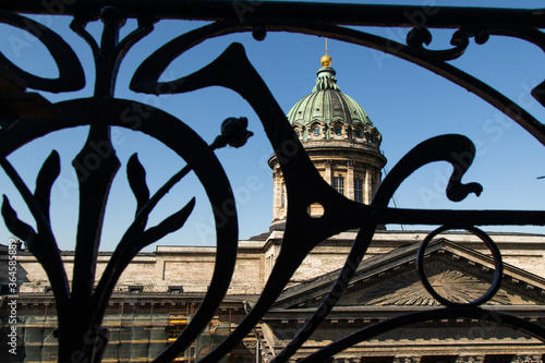 The dome of the Kazan Cathedral in St. Petersburg through the figured lattice of the terrace fence