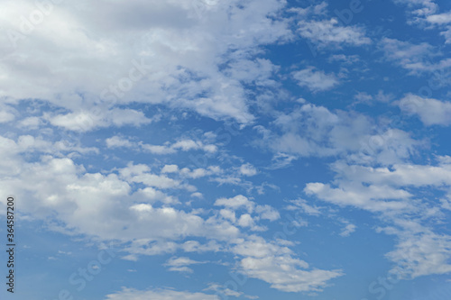 Fototapeta Naklejka Na Ścianę i Meble -  abstract background of white fluffy clouds on a bright blue sky