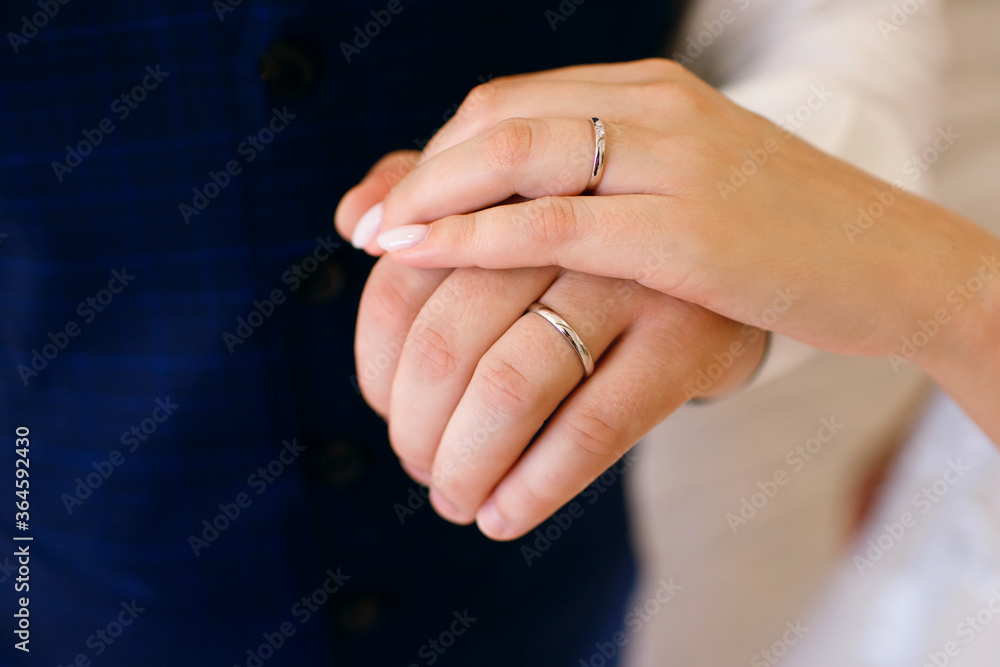 Wedding, close-up hand of the bride and groom, wedding rings, horizontal photo, free space for text, decoration, hug, loving man and woman