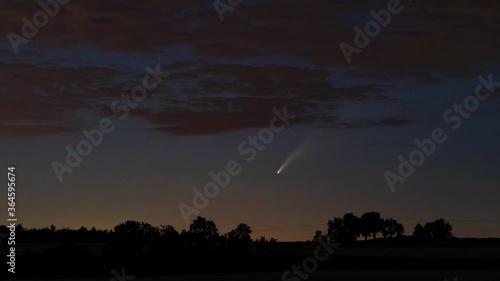 Adersbach, Germany - July 11, 2020: Comet C/2020 F3 (Neowise) moving low over the horizon, about 1 hour after sunset.