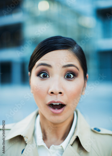 Close up of wide-eyed businesswoman