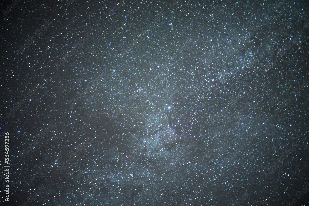 Obraz premium Astrological night sky with stars and constellations. The Milky Way and the accumulation of space debris in the galaxy.