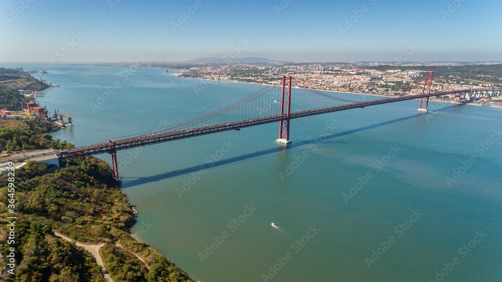 Aerial bridge on April 25th, statue of Jesus Christ Lisbon, Portugal. Historical memo. Close-up.