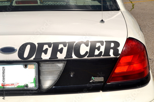 Back of a Police Car - Officer