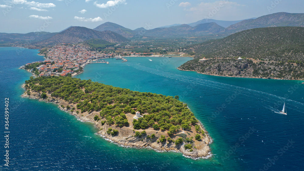 Fototapeta premium Aerial drone photo of picturesque city of Ermioni built in peninsula with forest of Bistis at the end, Argolida, Peloponnese, Greece