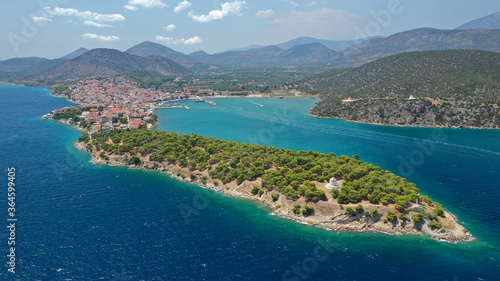 Aerial drone photo of picturesque city of Ermioni built in peninsula with forest of Bistis at the end, Argolida, Peloponnese, Greece