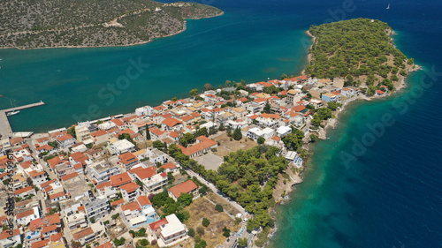 Aerial drone photo of picturesque city of Ermioni built in peninsula with forest of Bistis at the end, Argolida, Peloponnese, Greece