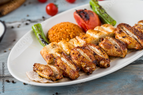Turkish cuisine chicken wings grill. Grilled chicken wings on wooden background