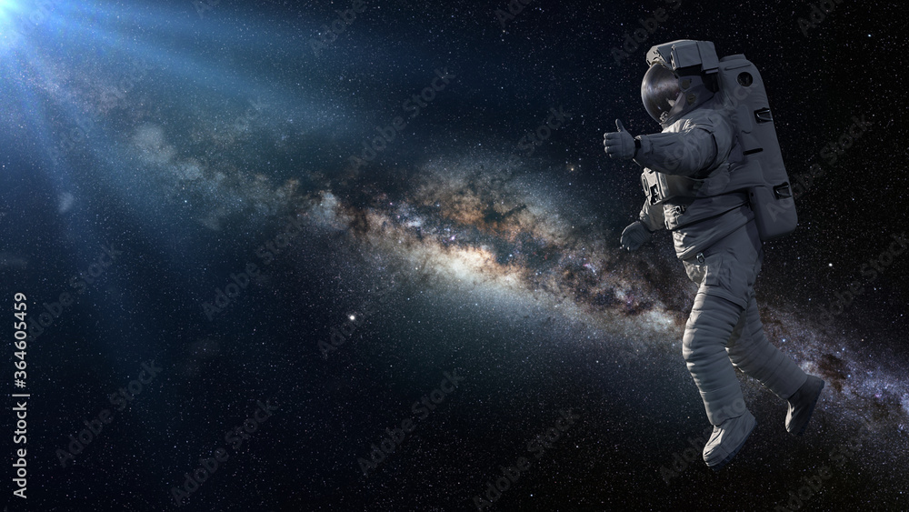 Fototapeta premium astronauta pokazujący kciuki do góry podczas spaceru kosmicznego