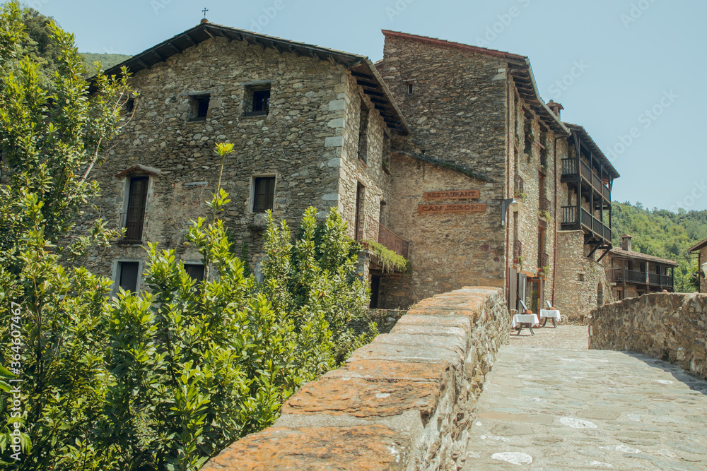 BEGET GIRONA, SPAIN - JULY 2020: Medieval mountain village in the middle of nature. Beget, Girona in Catalonia