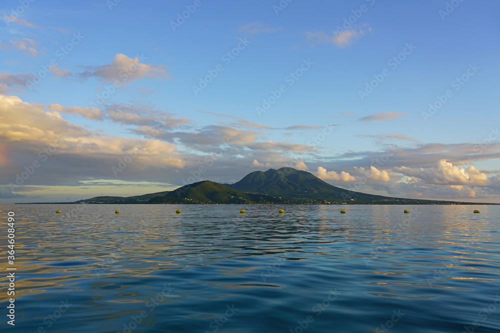 Sunset view of the Nevis Peak volcano across the water from St Kitts