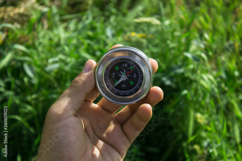 compass against grass background