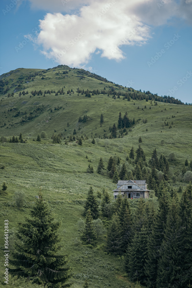 A house with a mountain in the background