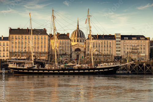 Ship docked in Nantes harbour with the city in the background .Quai de la Fosse © pixilatedplanet