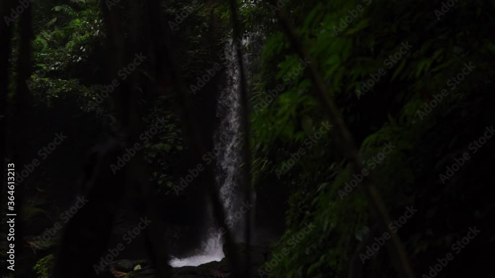 Close up view of a beautiful hidden waterfall in Bali, Indonesia Close up view of a beautiful hidden waterfall in Bali, Indonesia