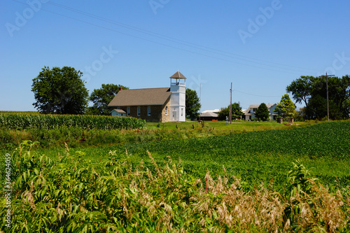 A small old country church in a field in Kansas