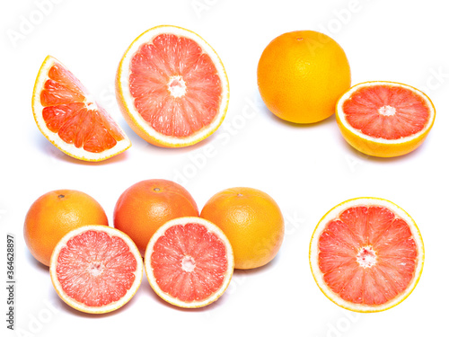 Close up of a sliced fresh grapefruit ,Slice of red grapefruit isolated on white background