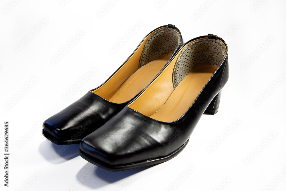 The shoes have black heels, high heels. Women's shoes with heels Shoes isolated on a white background Shoes for female students The shoes have black heels, high heels. Women's shoes with heels Shoes isolated on a white background Shoes for female students
