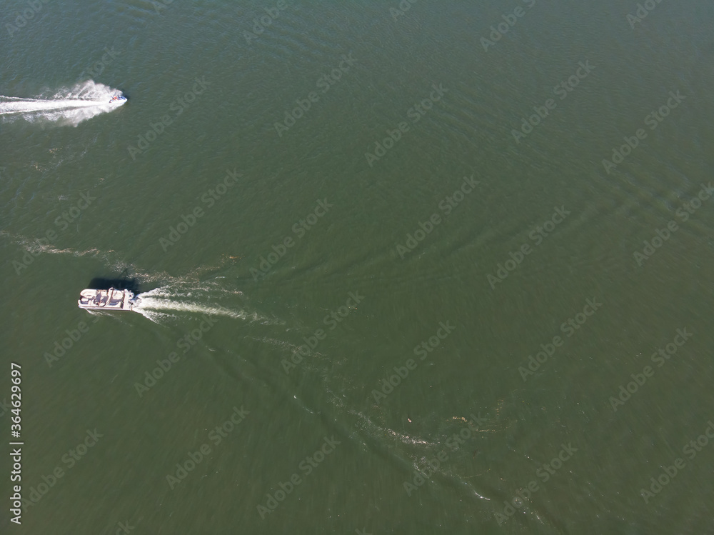 Naklejka premium Floating boat on the river, aerial view