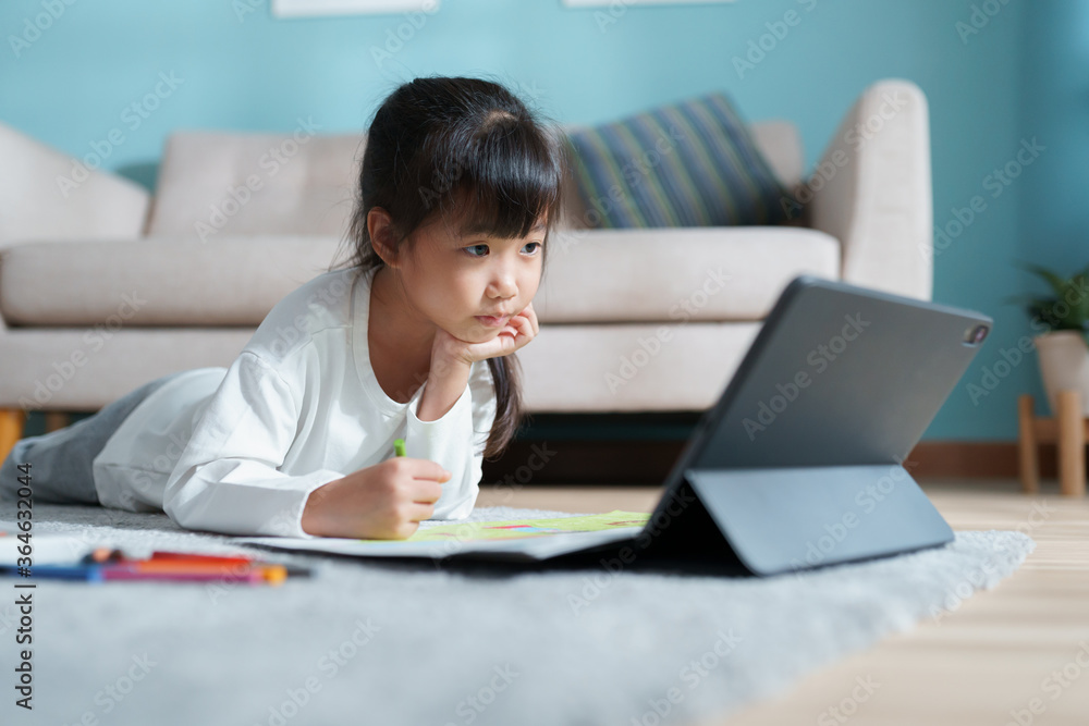 homeschooling. Asian little girl doing drawing with online teacher on tablet digital homeschooling. Asian little girl doing drawing with online teacher on tablet digital