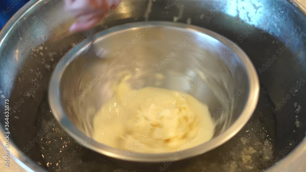 Stir the ice cream in an aluminum container around it On the ice Stir the ice cream in an aluminum container around it On the ice