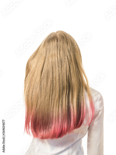 A girl adjusts her dyed hair isolated on a white background.