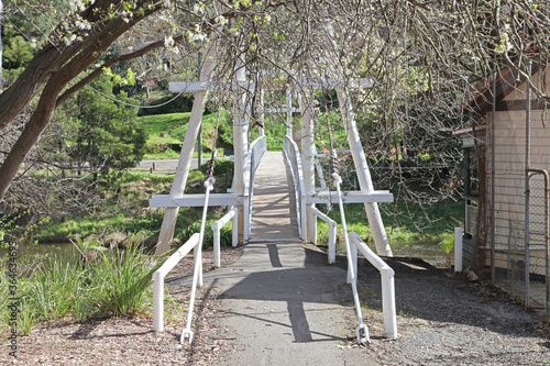 Suspension bridge and gardens in the town of Warburton, Victoria, Australia photo