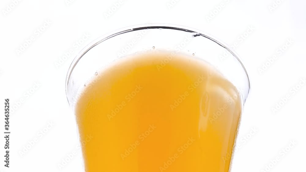 Ice Cubes Falling Into Orange Juice Ice Cubes Falling Into Orange Juice