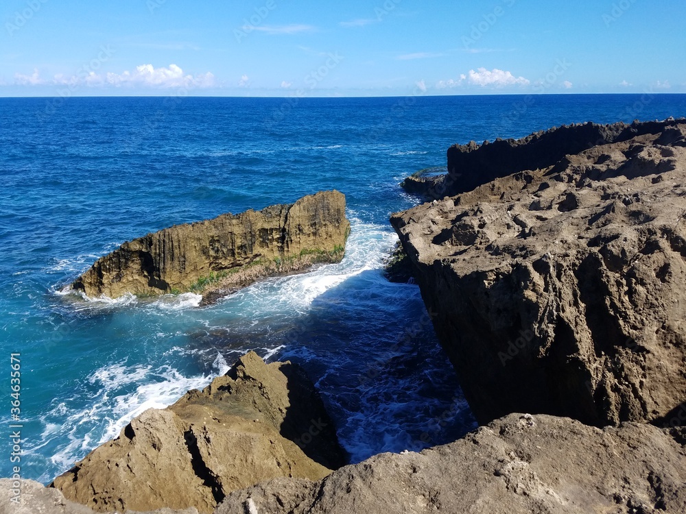 rocky shore with ocean water in Isabela, Puerto Rico