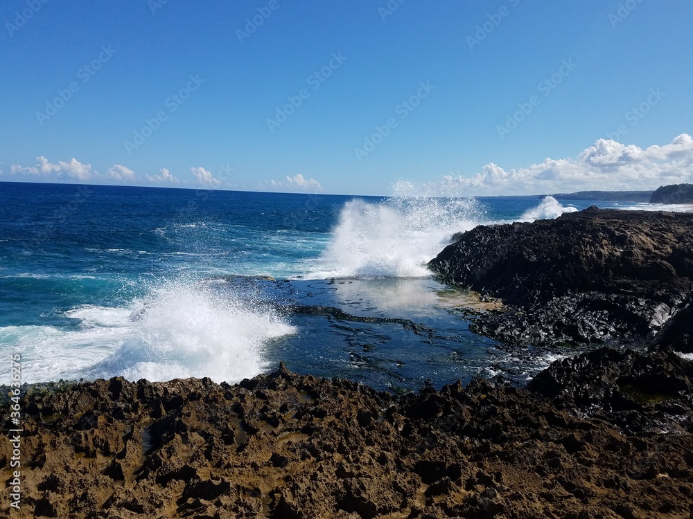 rocky shore with ocean water in Isabela, Puerto Rico