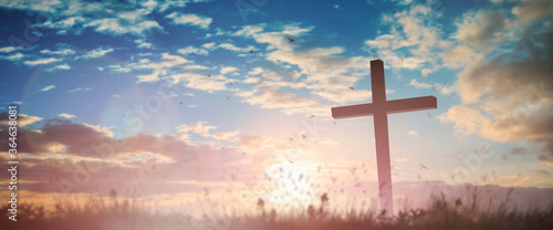Obraz na plátně Silhouette jesus christ crucifix on cross on calvary sunset background concept for good friday he is risen in easter day, good friday worship in God, Christian praying in holy spirit religious