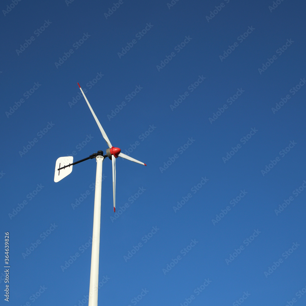 the wind turbine in sky background with space for text or image
the wind turbine in sky background with space for text or image