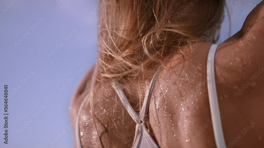 Slomo: Young Athletic Woman Streching Her Muscular Back On The Beach Slomo: Young Athletic Woman Streching Her Muscular Back On The Beach