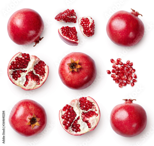 Fotografie A set of pomegranate whole and sliced isolated on white background