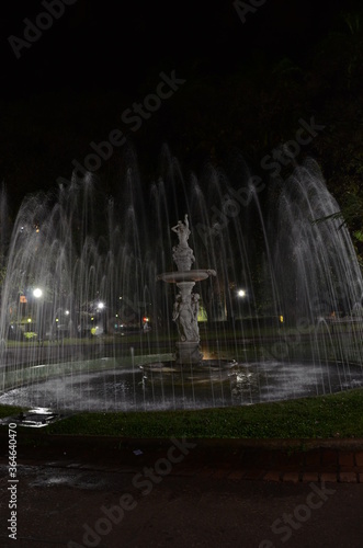 Pra  a da Liberdade  translated as Liberty Square  at Belo Horizonte in the state of Minas Gerais in Brazil at night with water fountain on
