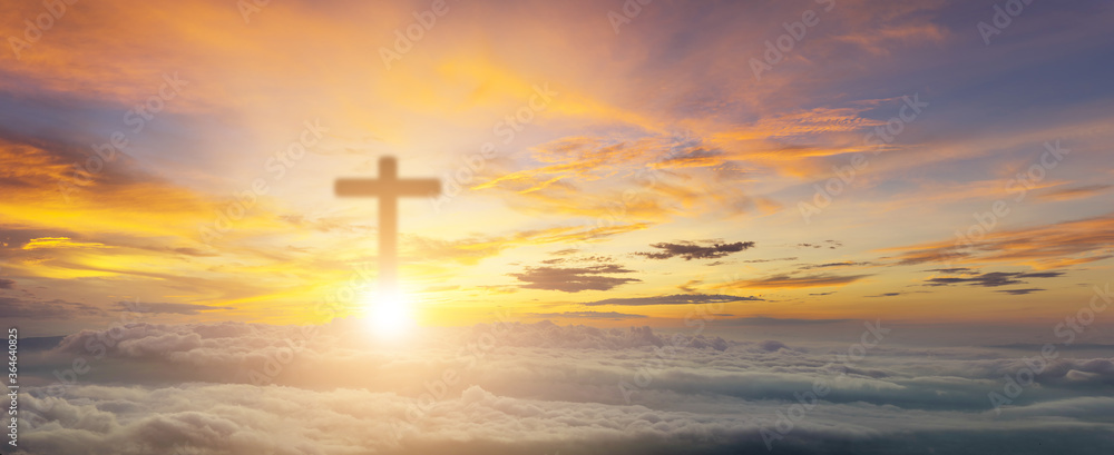 Conceptual wood cross or religion symbol over a sunset sky with clouds background for God. belief or resurrection of god and worship christian. Foggy and beautiful sky christian. Christian Religion.