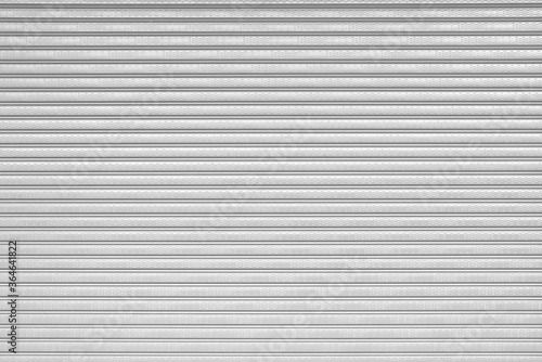 Grey roller shutter door texture background, corrugated metal sheet, Slide door