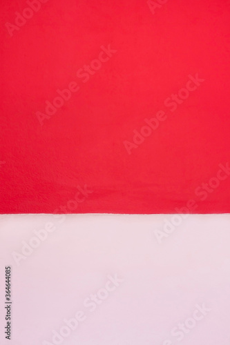 White and red background and in the image, there is more red than white