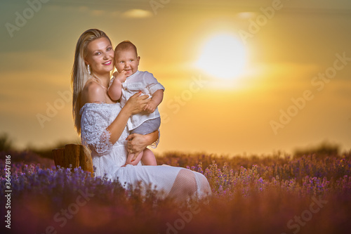 Young mother and her son in a lavender field